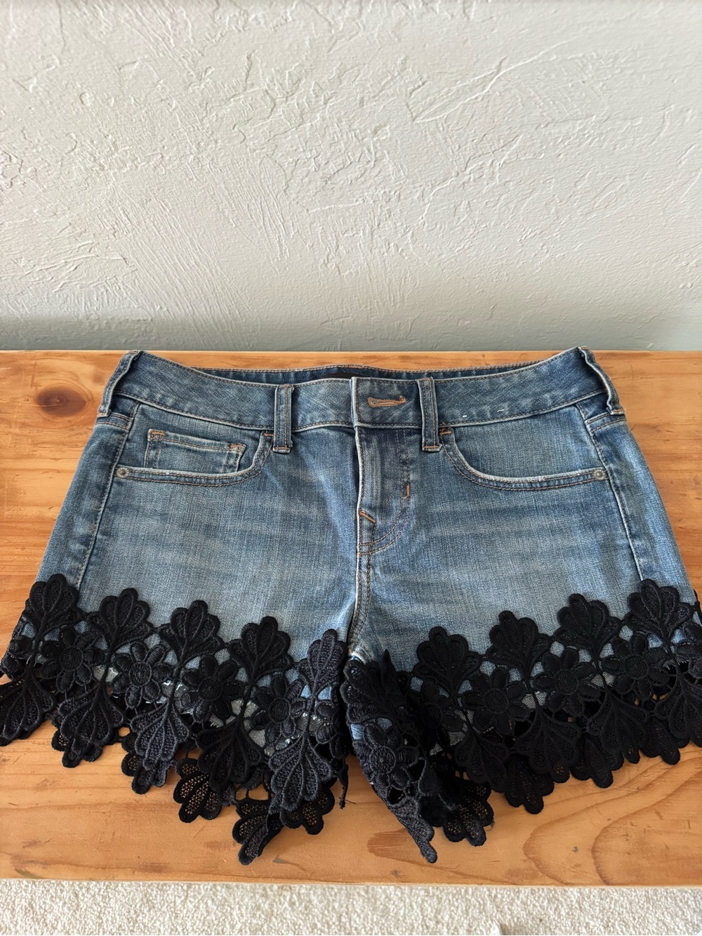 Brand new Express Denim Shorts with Black Floral Lace Hem size 0